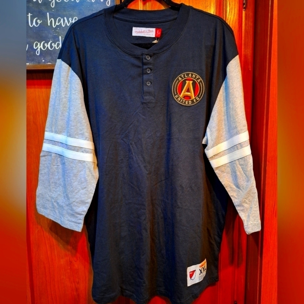 A Mitchell and Ness official MLS 3/4 sleeve Atlanta United Henley in a men's 2XL